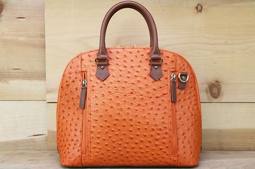 Gun Tote'n Mamas Ostrich/Orange Bowler (GTM-97OST/ORG) Fits Small Pistols & Revolvers, Ambidextrous Hand